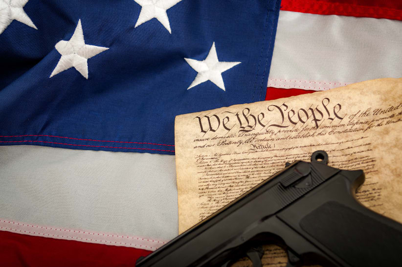 U.S. Flag, U.S. Constitution and a handgun