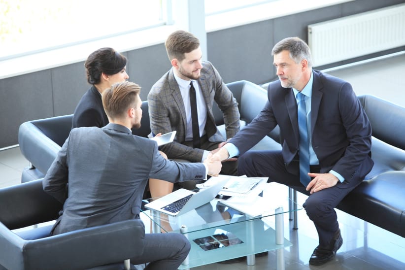 Business people shaking hands, finishing up a meeting