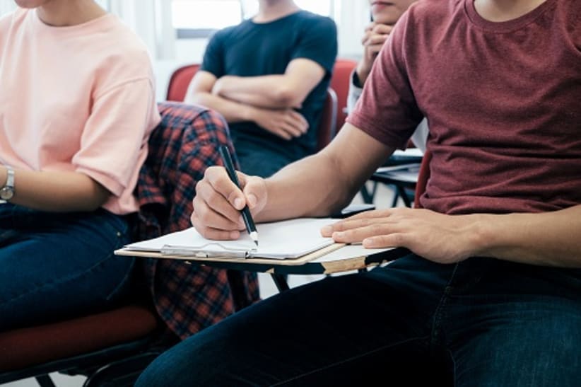 University students  studying in classroom.