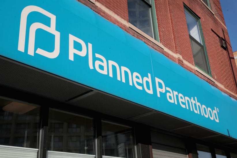 CHICAGO, IL - MAY 18:  A sign hangs above a Planned Parenthood clinic on May 18, 2018 in Chicago, Illinois. The Trump administration is expected to announce a plan for massive funding cuts to Planned Parenthood and other taxpayer-backed abortion providers by reinstating a Reagan-era rule that prohibits federal funding from going to clinics that discuss abortion with women or that share space with abortion providers.  (Photo by Scott Olson/Getty Images)
