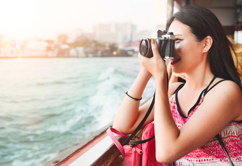 girl traveling, on vacation taking a picture