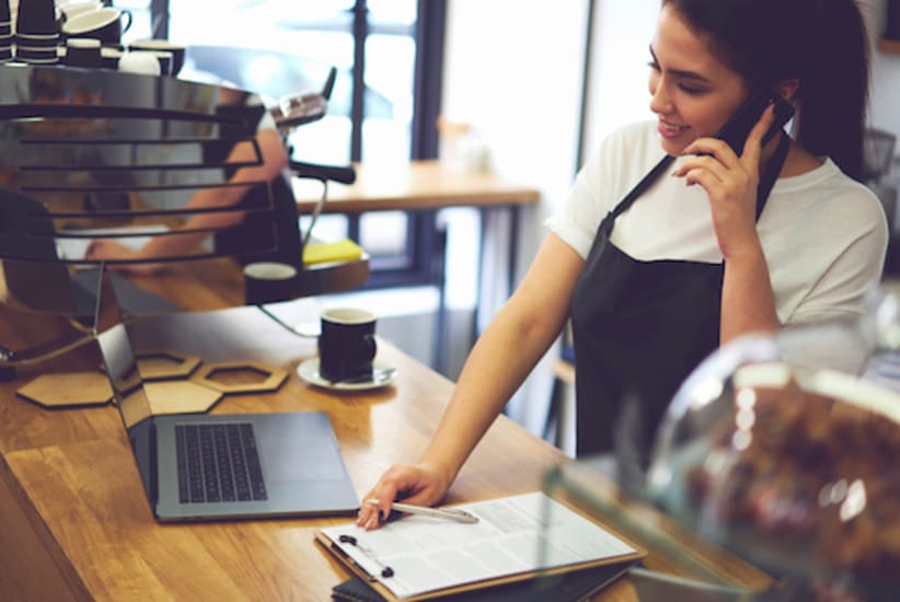 barista on the phone at work
