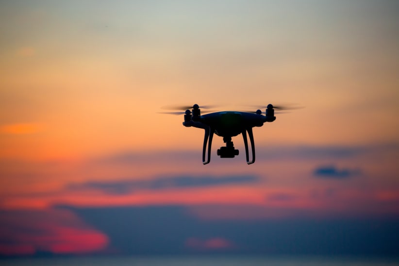The drone in sunset sky.