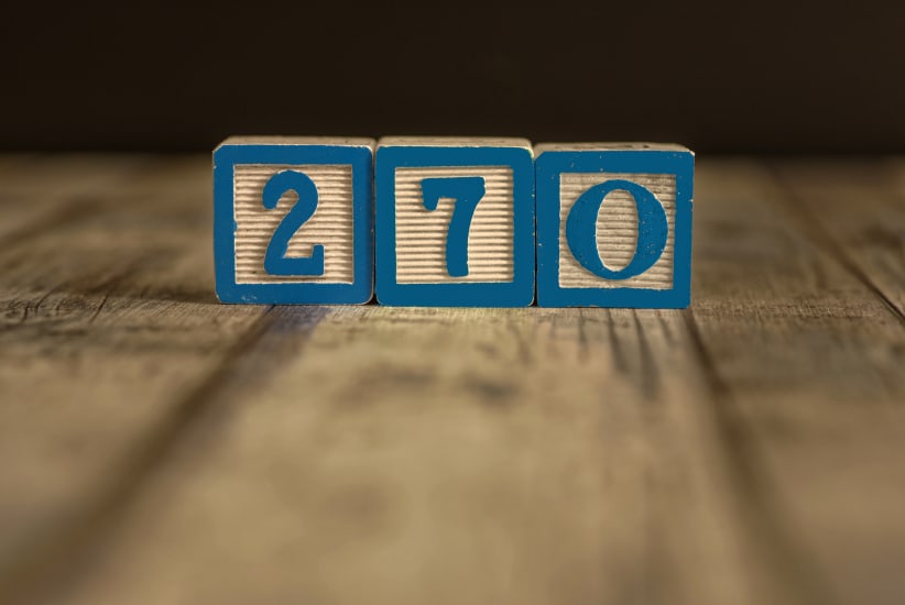 Wood blocks in blue with 270 on them to represent the number of Electoral College votes needed to win the US presidential election