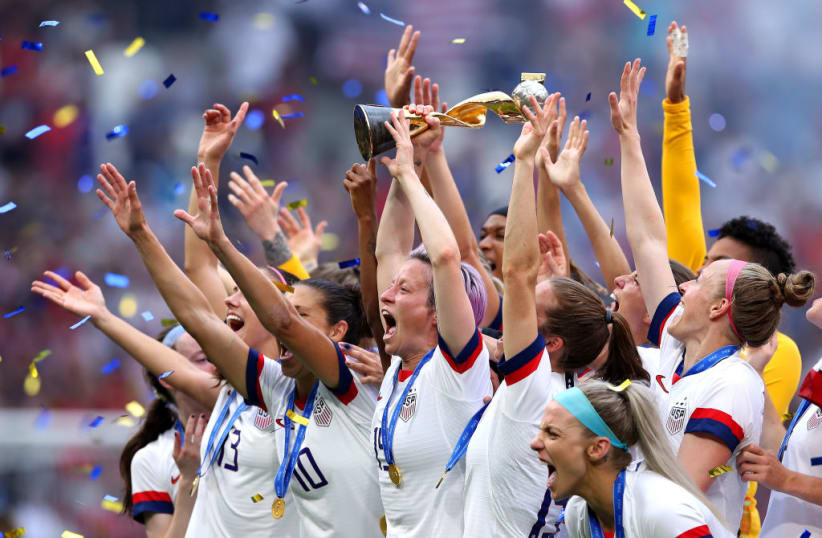LYON, FRANCE - JULY 07:  Megan Rapinoe of the USA lifts the FIFA Women's World Cup Trophy following her team's victory in the 2019 FIFA Women's World Cup France Final match between The United States of America and The Netherlands at Stade de Lyon on July 07, 2019 in Lyon, France. (Photo by Alex Grimm/Getty Images)