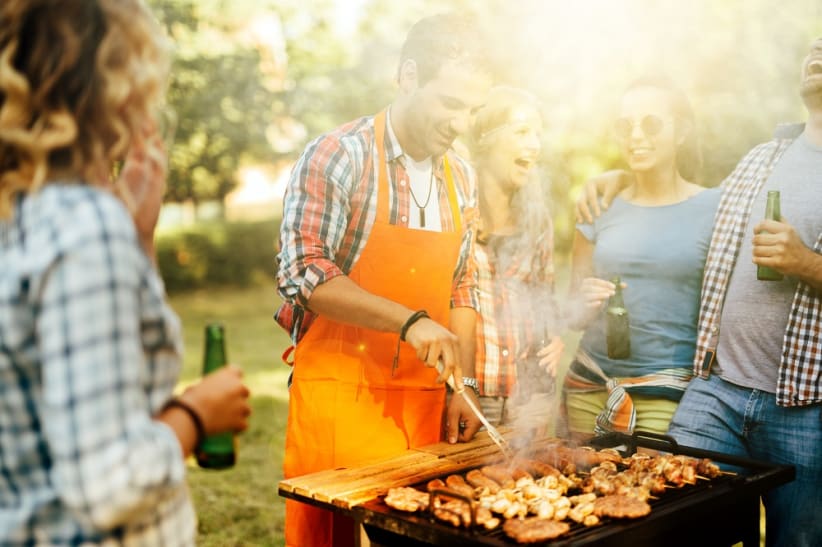 Young people enjoying barbecuing before COVID-19 restrictions. Young people enjoying barbecuing before COVID-19 restrictions.